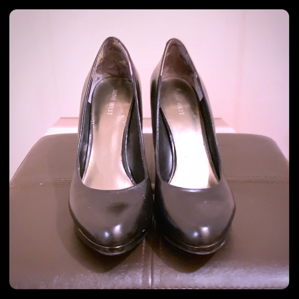 Black leather pumps